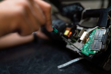 Photo by ThisisEngineering RAEng person holding green and black circuit board